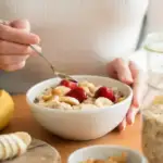 Delicious assortment of healthy breakfast options with fruits and oats, including oatmeal, chia pudding, avocado toast, and more