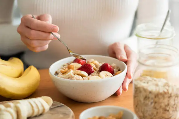 Delicious assortment of healthy breakfast options with fruits and oats, including oatmeal, chia pudding, avocado toast, and more